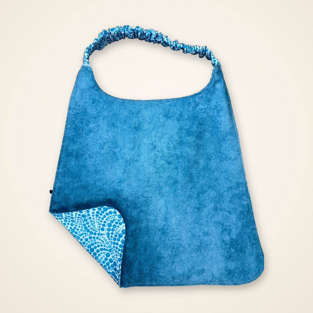 Aqua Dots / Solid Aqua drool bib, aqua side