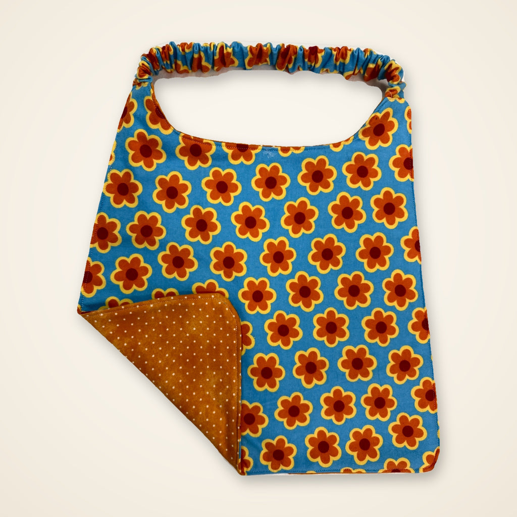 Retro Flowers / Orange Dots drool bib, flower side