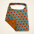 Retro Flowers / Orange Dots drool bib, flower side