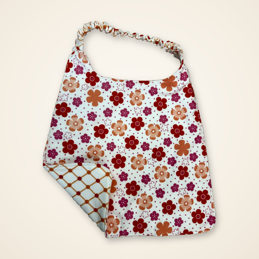 Coral Flowers / Orange Lattice drool bib, flower side