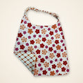 Coral Flowers / Orange Lattice drool bib, flower side