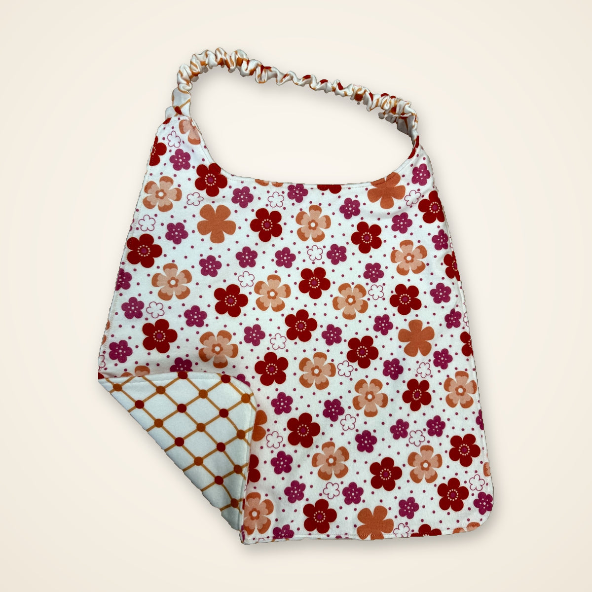 Coral Flowers / Orange Lattice drool bib, flower side