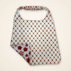 Coral Flowers / Orange Lattice drool bib, lattice side