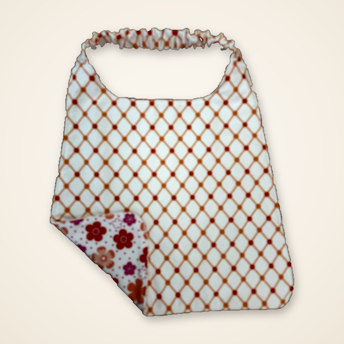 Coral Flowers / Orange Lattice drool bib, lattice side