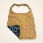 Teal Geometric / Gold Herringbone drool bib, gold side