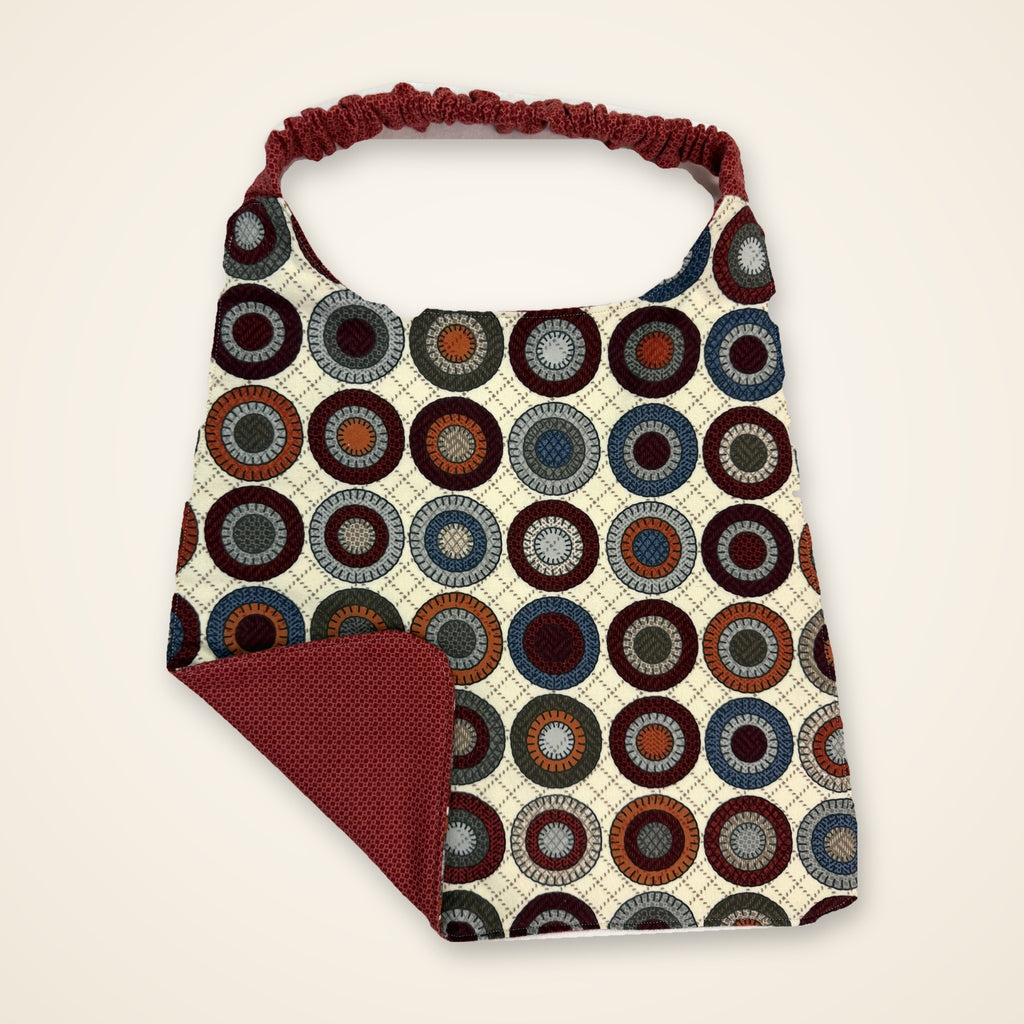 Brick Red / Penny Circles drool bib, penny side