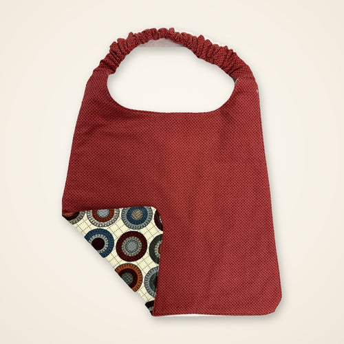 Brick Red / Penny Circles drool bib, red side