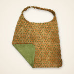 Green Grid / Orange Stars drool bib, orange star side