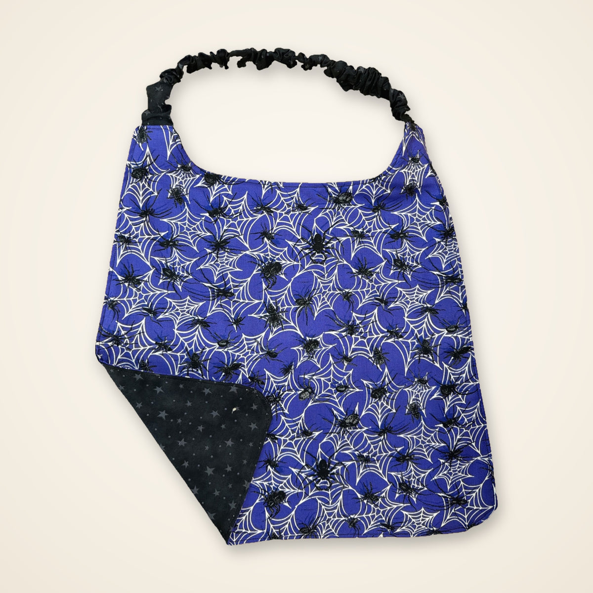 Purple Spiders / Black Stars drool bib, purple spider side