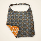Orange Ghosts / Gray Geometric drool bib, gray geometric side