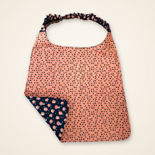 Black Pumpkins / Orange Stars drool bib, orange stars side
