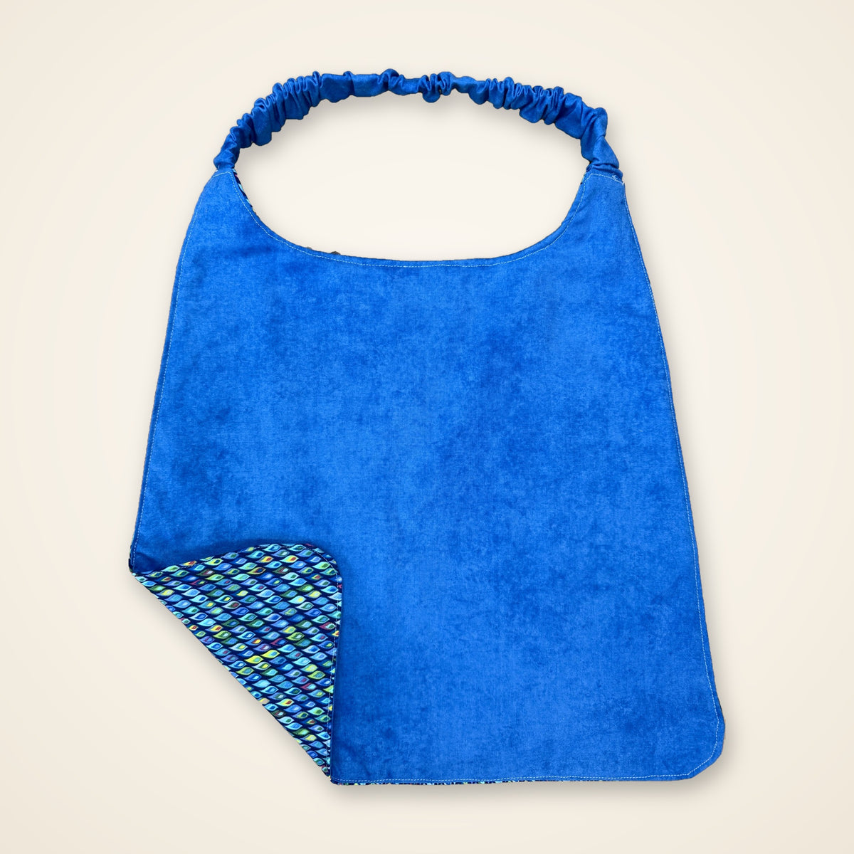 Blue Mosaic / Solid Blue drool bib, blue side
