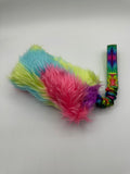 Handmade rainbow faux fur agility tug toy with a bungee handle