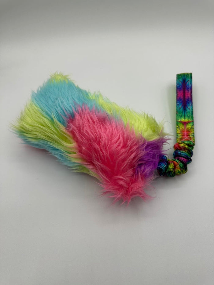Handmade rainbow faux fur agility tug toy with a bungee handle