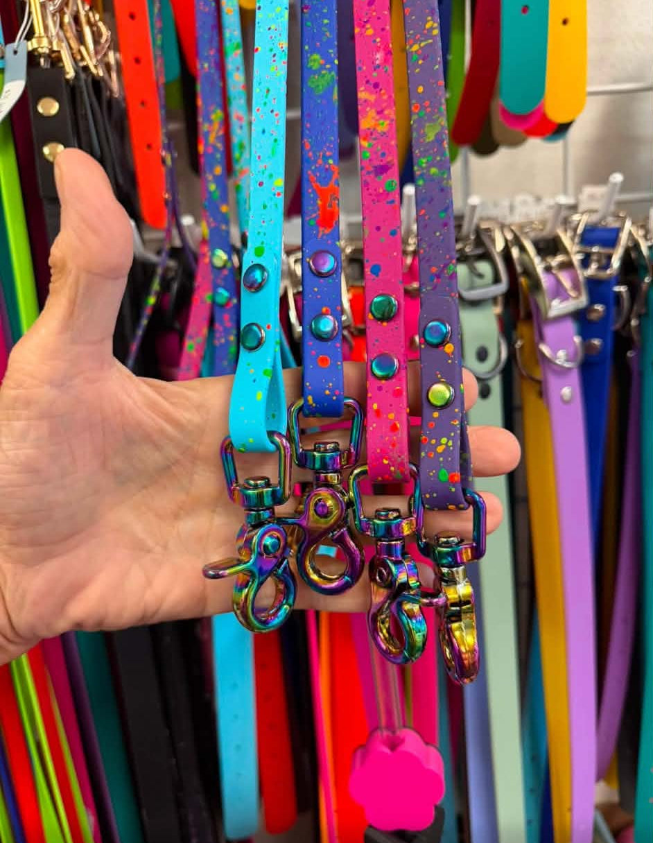 Four spattered biothane leashes in sky blue, royal blue, hot pink and violet with iridescent snaps